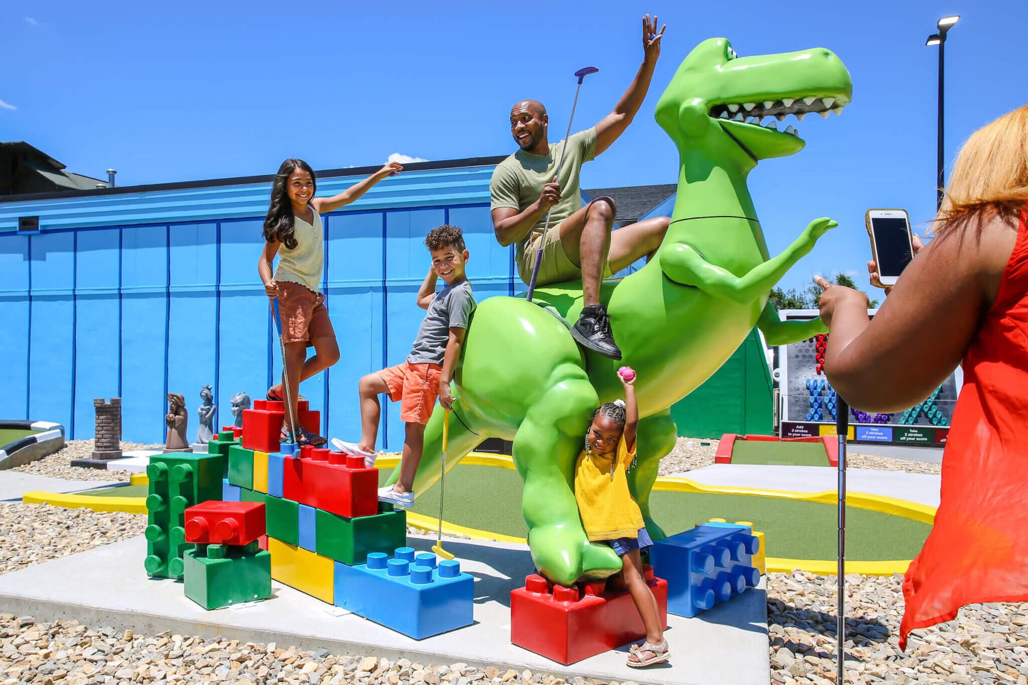 Family surrounding the dinosaur