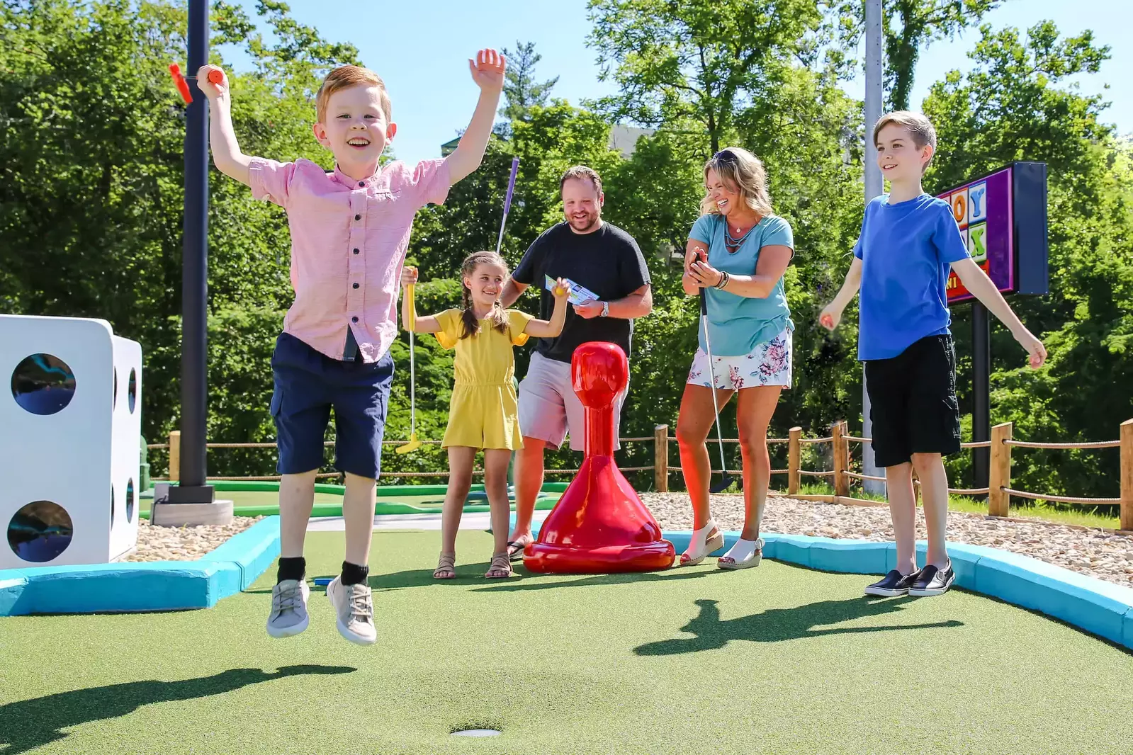 family on mini golf course